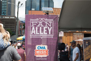 Fan Alley purple stage sign photo in Nashville, Tennessee for CMA Music Festival