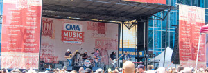 Live photo of Plaza Stage and background art for CMA Music Festival