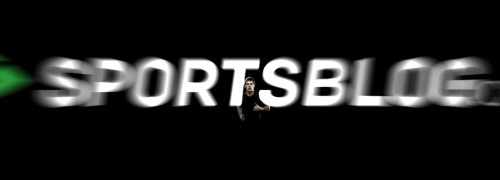 Sportsblog.com super still frame from Nashville, TN based Sportsblog web promo video designed and animated by Nashville's ST8MNT employing a dark back lit sports fitness style with depth of field motion blur logotype with a man in the black void running towards camera