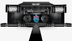 Front view rendering of 1989 World Tour stage and scrims design featuring neon typography and boombox elements for Taylor Swift