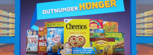 Still of bannered sample table in grocery store from Nashville based Outnumber Hunger 2016 TV Spot animated by Nashville's ST8MNT employing a large grocery store automatic glass door entrance with a sample table full of Fiber One, Hamburger Helper, Nature Valley, Pillsbury, Cheerios, Lucky Charms, Suddenly Salad, Old El Paso and Reese's Puffs
