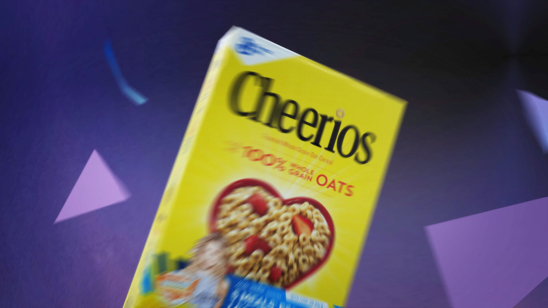 Still of whirling Cheerios box from Nashville based Outnumber Hunger 2016 TV Spot animated by Nashville's ST8MNT employing purple gradient canvas backdrops, cool toned triangular shards, motion blur and specially labeled stickers featuring Jennifer Nettles