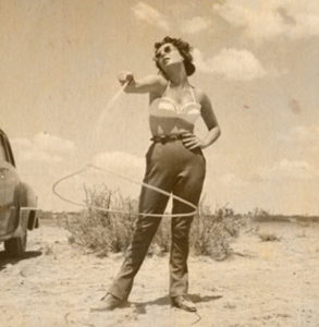 Photo of Elizabeth Taylor swinging a rope on a beach for ST8MNT Wrangling Creatives blog post