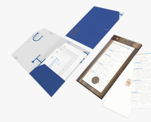 Image of a blue folder containing room service menus next to a breakfast order form hang tag.