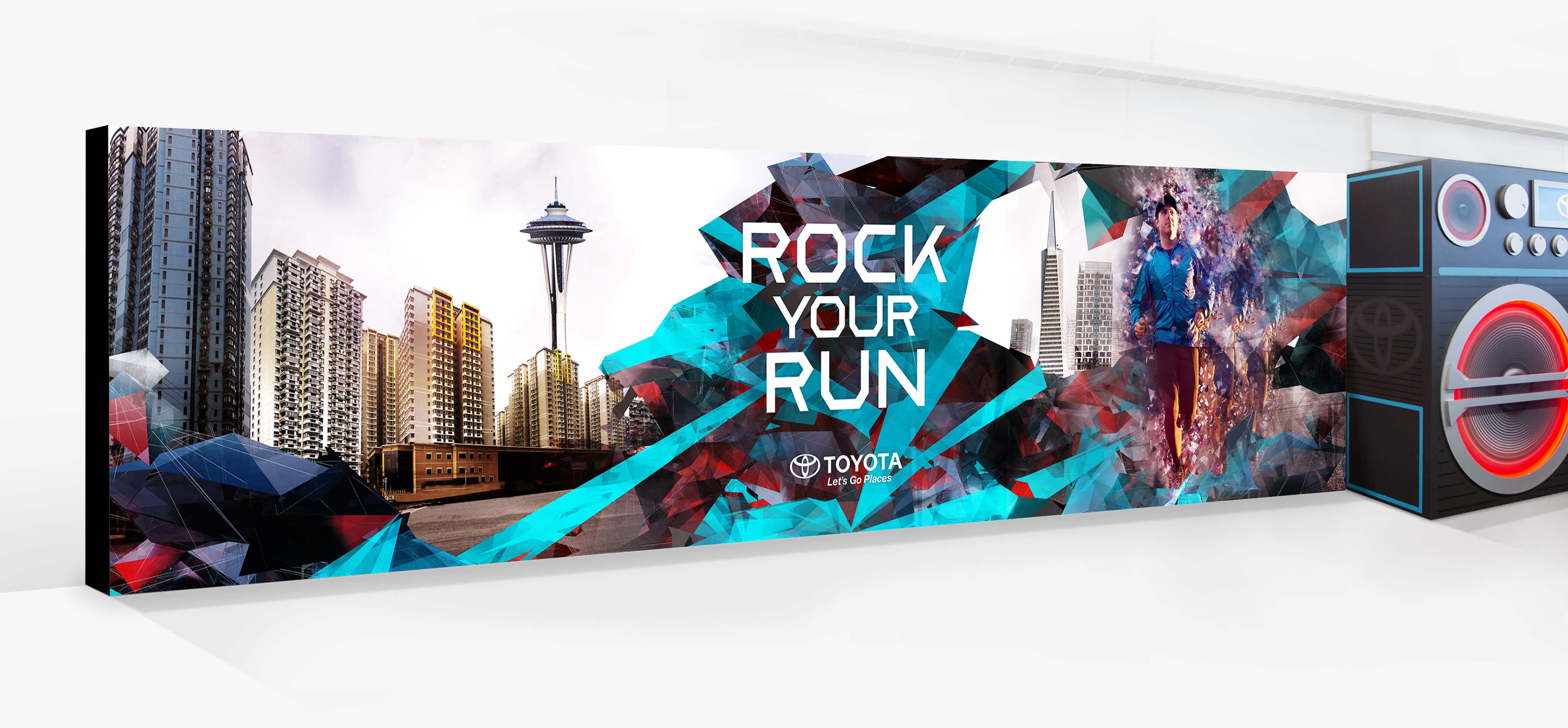 Toyota Rock Your Run back wall left panel featuring the Rock Your Run logo a city scape, the Seattle Space Needle, the San Francisco Transamerica Pyramid, dynamic geometric fragments, male runner, and the boombox.