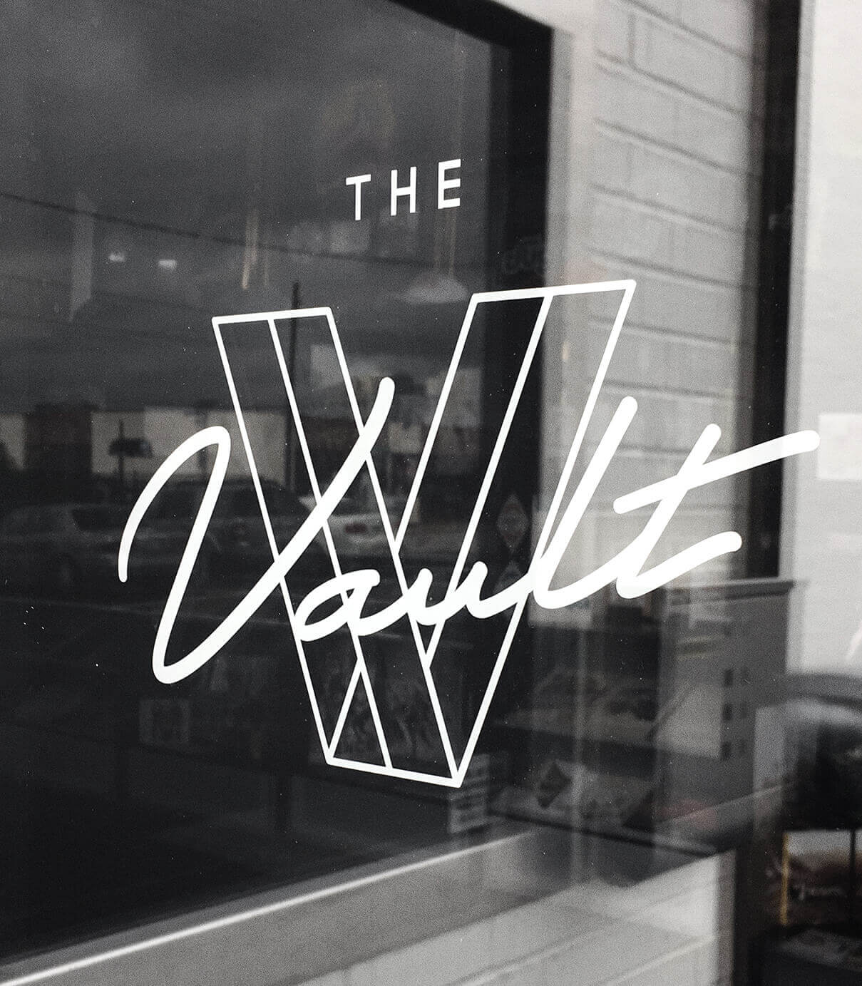 Exterior vinyl window signage of The Vault Nashville.