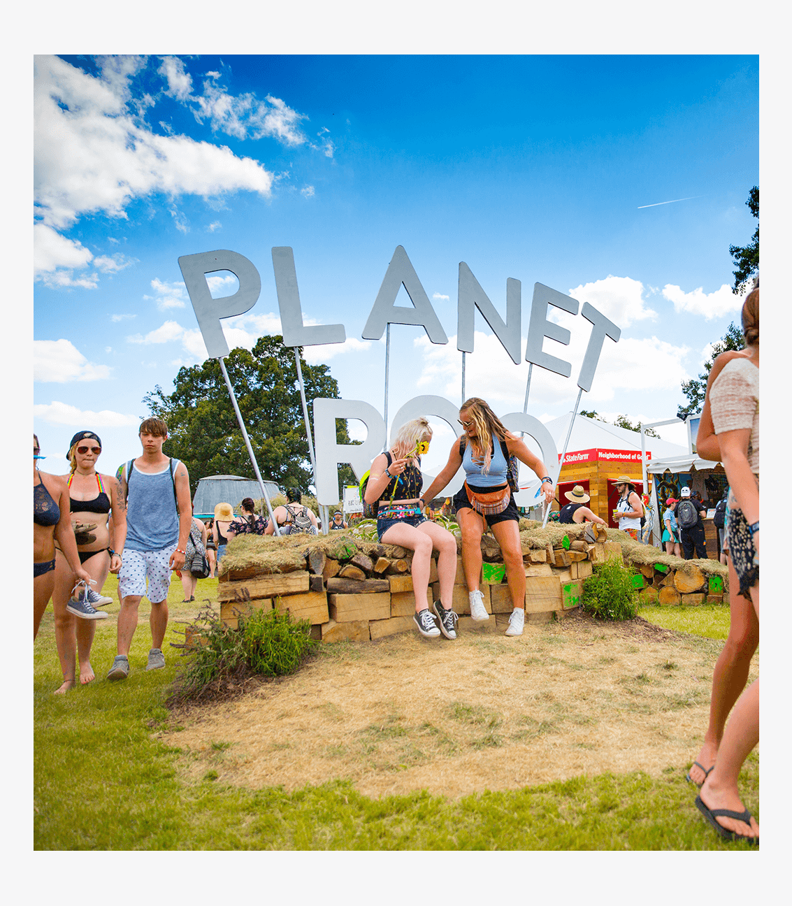 Photo of people interacting and taking pictures of the Planet Roo Entryway in Centeroo at Bonnaroo Music & Arts Festival in Manchester, Tennessee