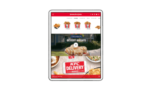 KFC website homepage kfc.com featured on illustrated tablet