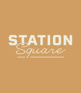 Station Square typographic lockup in cream on mustard yellow