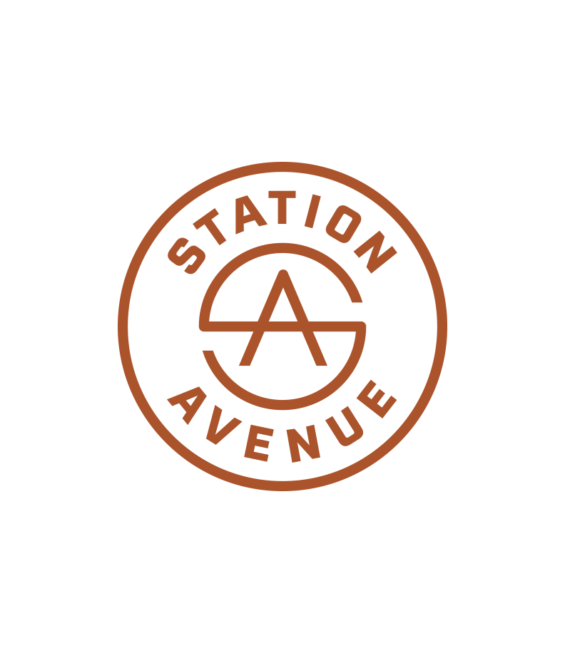Station Avenue circular logo crest in rust color