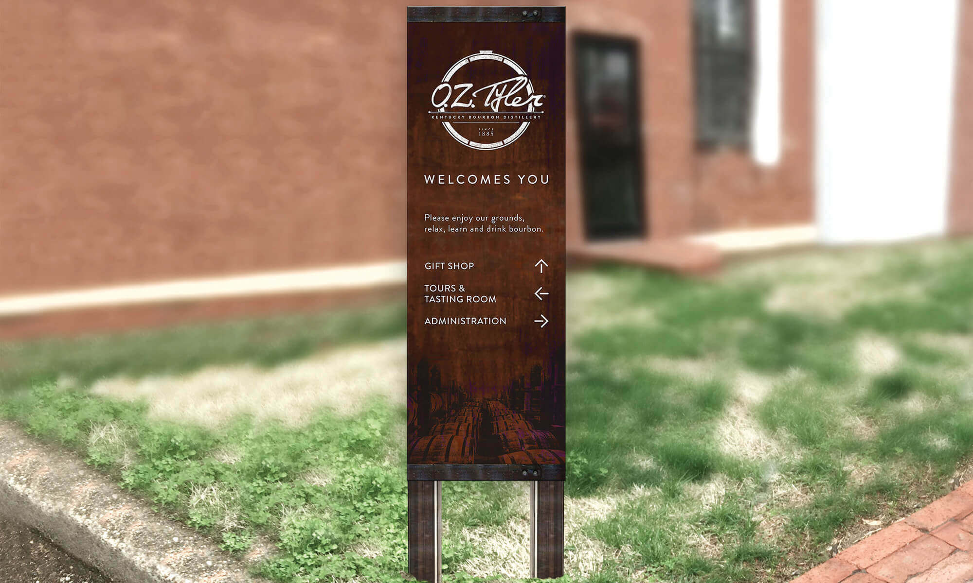 OZ Tyler free standing wayfinding weathered metal with oak barrel imagery that features logo and arrows pointing to gift shop, tours and administration