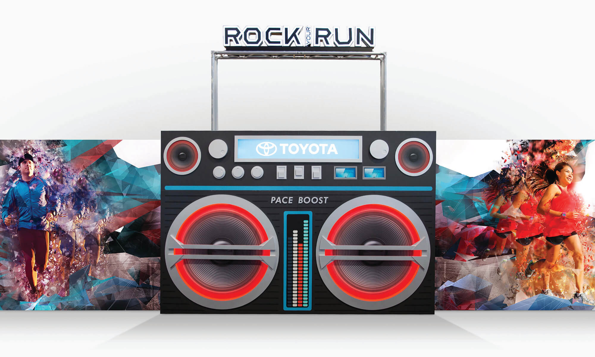 Render of Toyota Rock Your Run boom box backdrop with geometric shapes and imagery of people running
