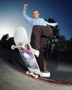 image of Jason Dill doing a back heel skateboard trick by Michael Schmelling
