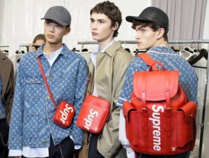 Men wearing backpacks from the Supreme x Louis Vuitton fashion collaboration