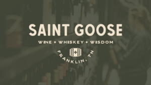 Saint Goose logo on dark green photographic background