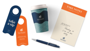 DSR collateral mockups with branded coffee cup and notepad