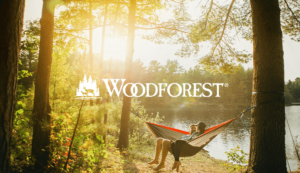 Image of couple in hammock on lake with Woodforest logo
