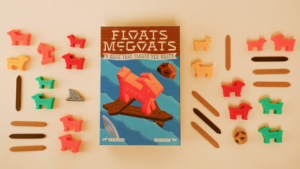 Floats McGoats board game elements that were part of package design by ST8MNT neatly organize on a cream background