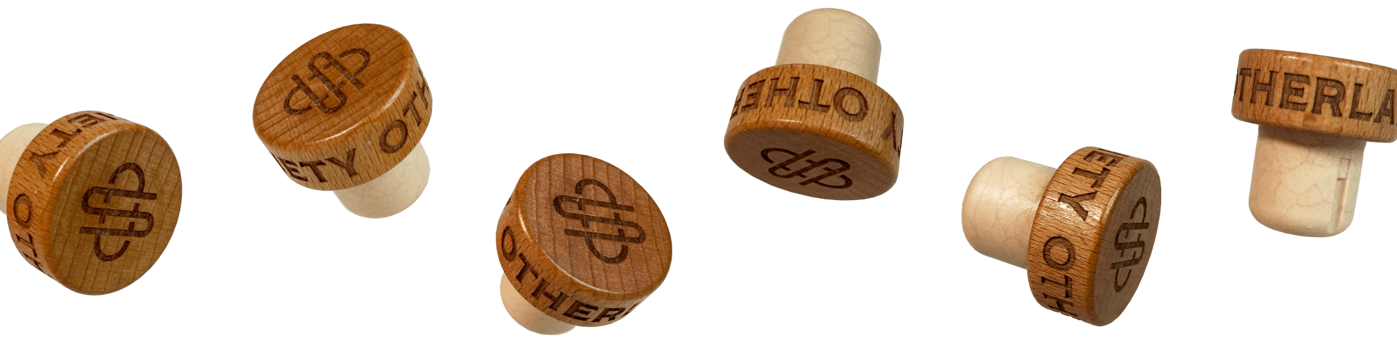 a row of floating wooden bottle caps with engraved Otherland society text and OS monogram logo