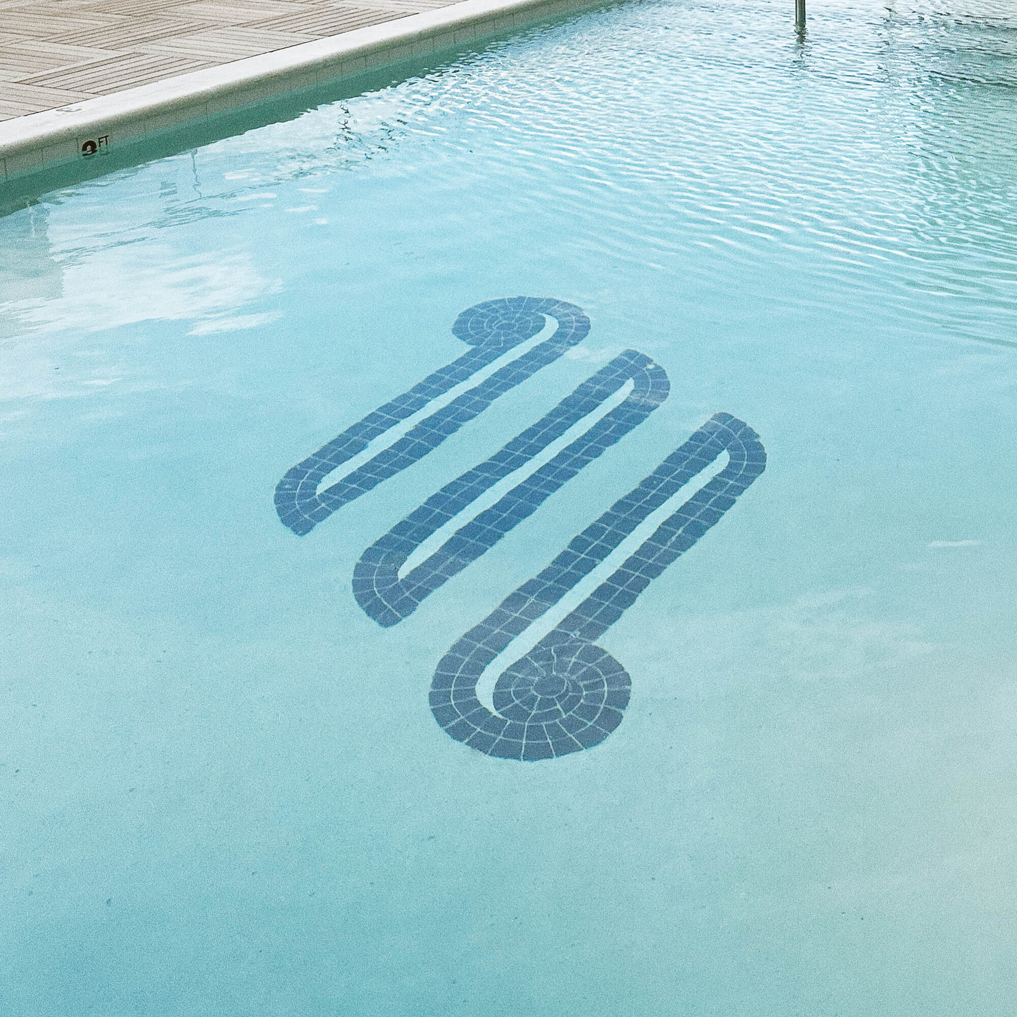 Pool floor tile mosaic insignia featuring Motif on Music Row brand logo design