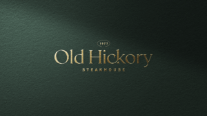 Old Hickory Steakhouse restaurant logo embossed on a green background