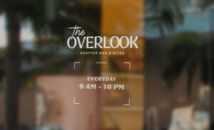 The Overlook logo with hours mocked up on window