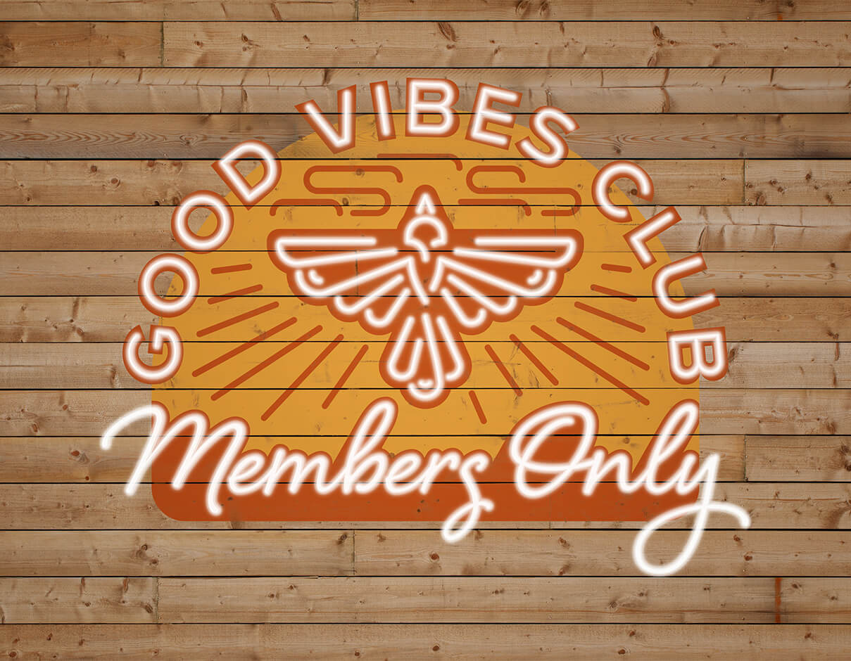 Good vibes club members only neon and painted sign on wooden background featuring bird illustration