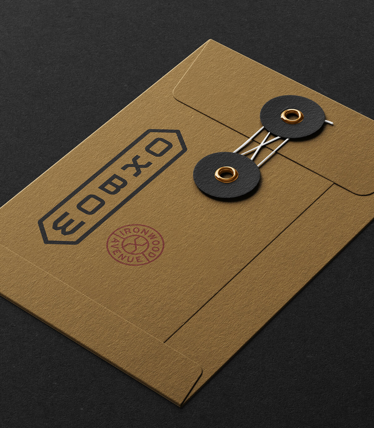 Oxbow branded gold envelope with logo stamps