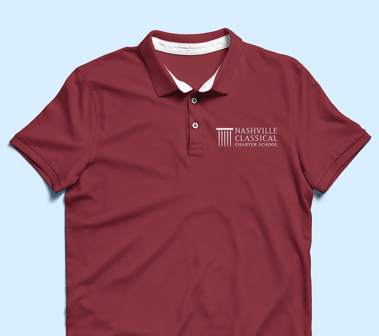 Nashville Classical Charter School rebrand application on polo shirt designed by ST8MNT