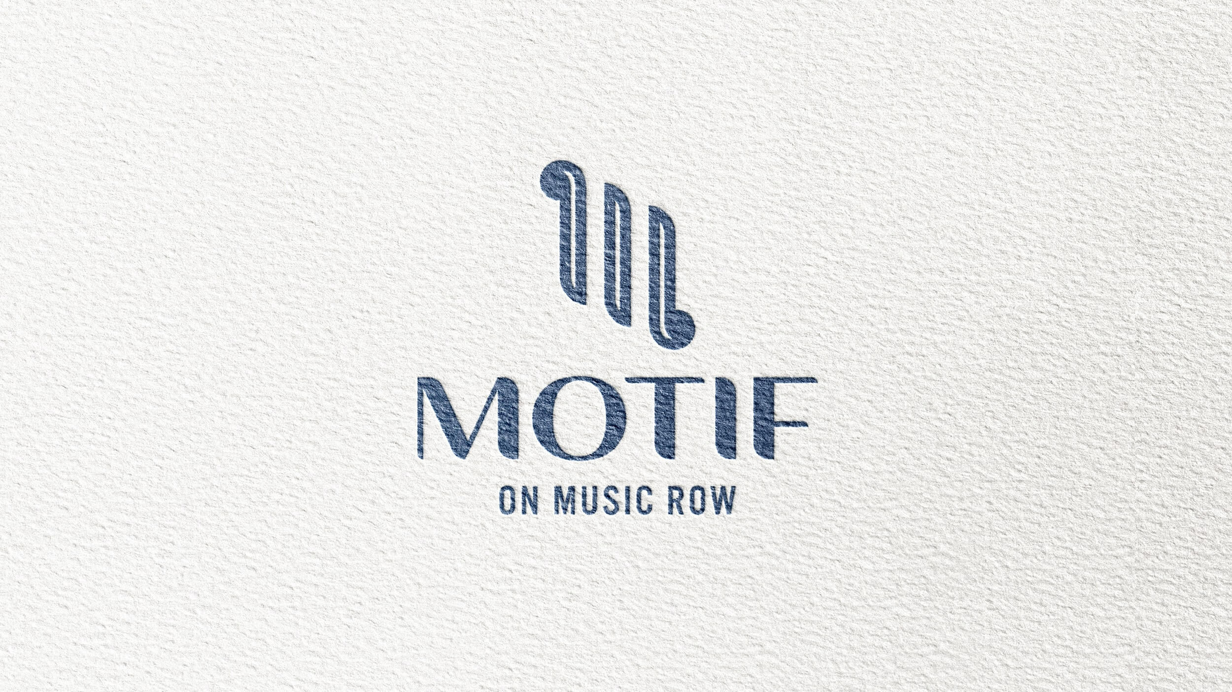 Motif logo on white wall