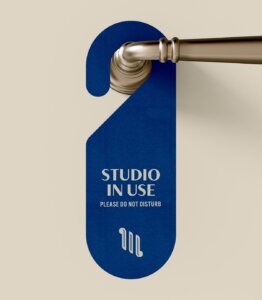 Motif on Music Row hotel door hanger which reads "Studio in use please do not disturb"