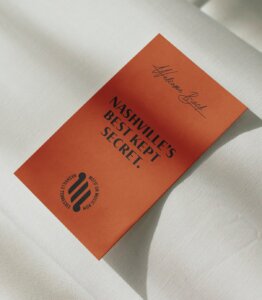 Motif on Music Row branded hotel bed note which reads "Nashville's best kept secret"