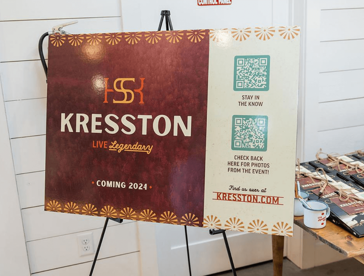 Image of large scale poster board with takeaway flyer design from the name reveal event