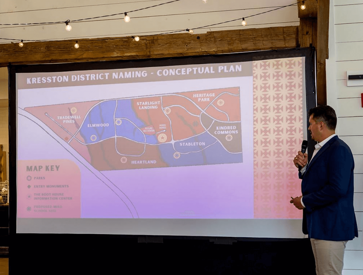 Image of presentation with map showing neighborhood names, being presented at the name reveal event