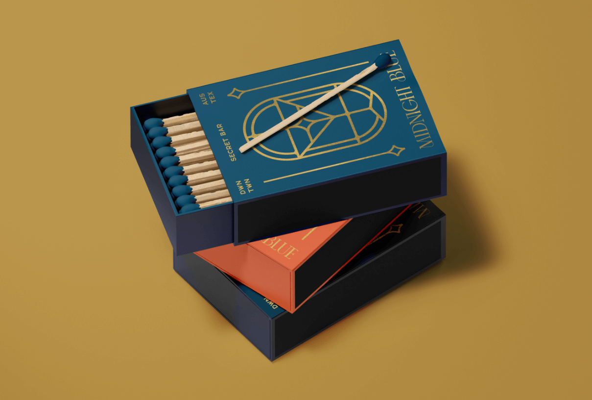 Mockup of branded matchbooks with graphic elements from Midnight Blue identity system created by ST8MNT as part of branding project for W Hotel in Downtown Austin