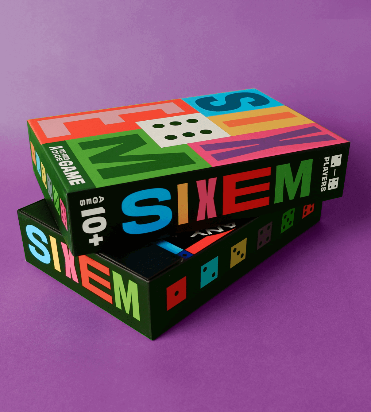 SIXEM box stacked with front cover sitting askew on top, showing off the designs of the box sides with colorful dice, SIXEM, ages 10+, and 2-4 players information