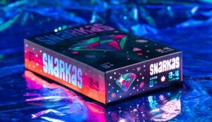 Snarkas box front cover and sides on holographic background as part of packaging design by ST8MNT