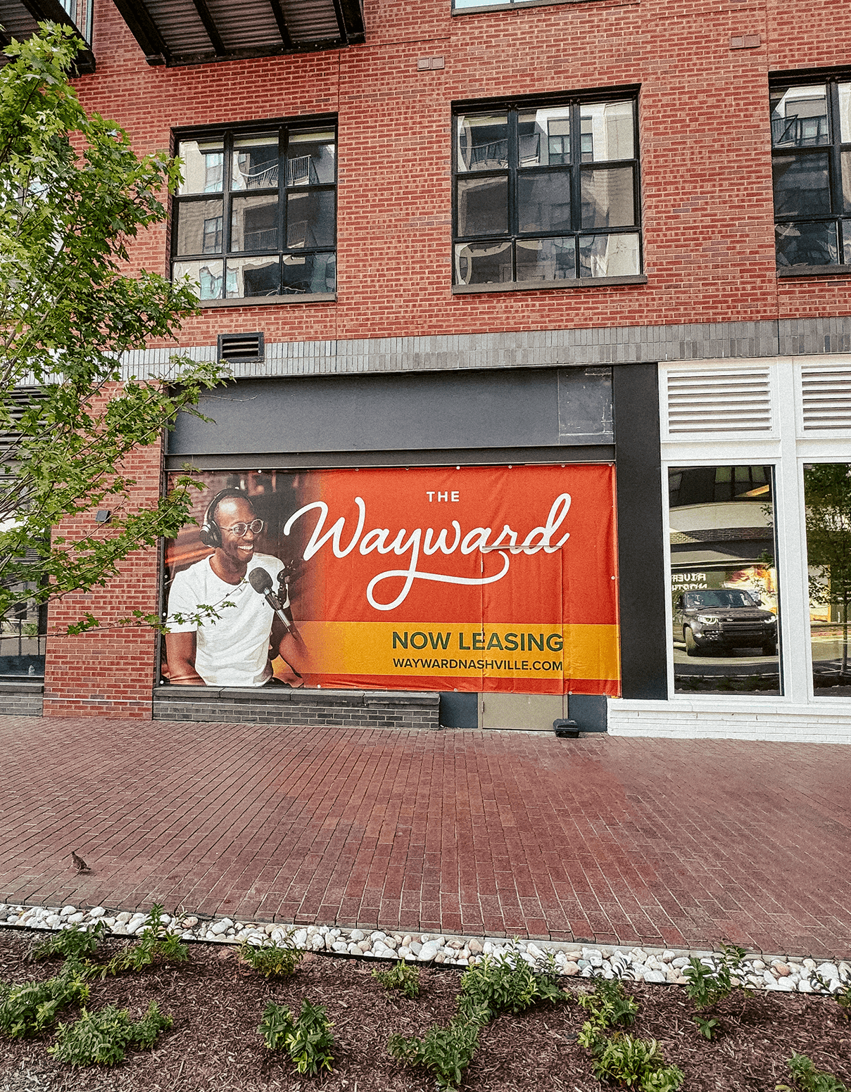 The Wayward Now Leasing building wrap design