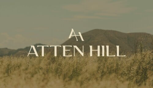 Atten Hill community logo designed by St8mnt place over top of an image of the Texas hill country.