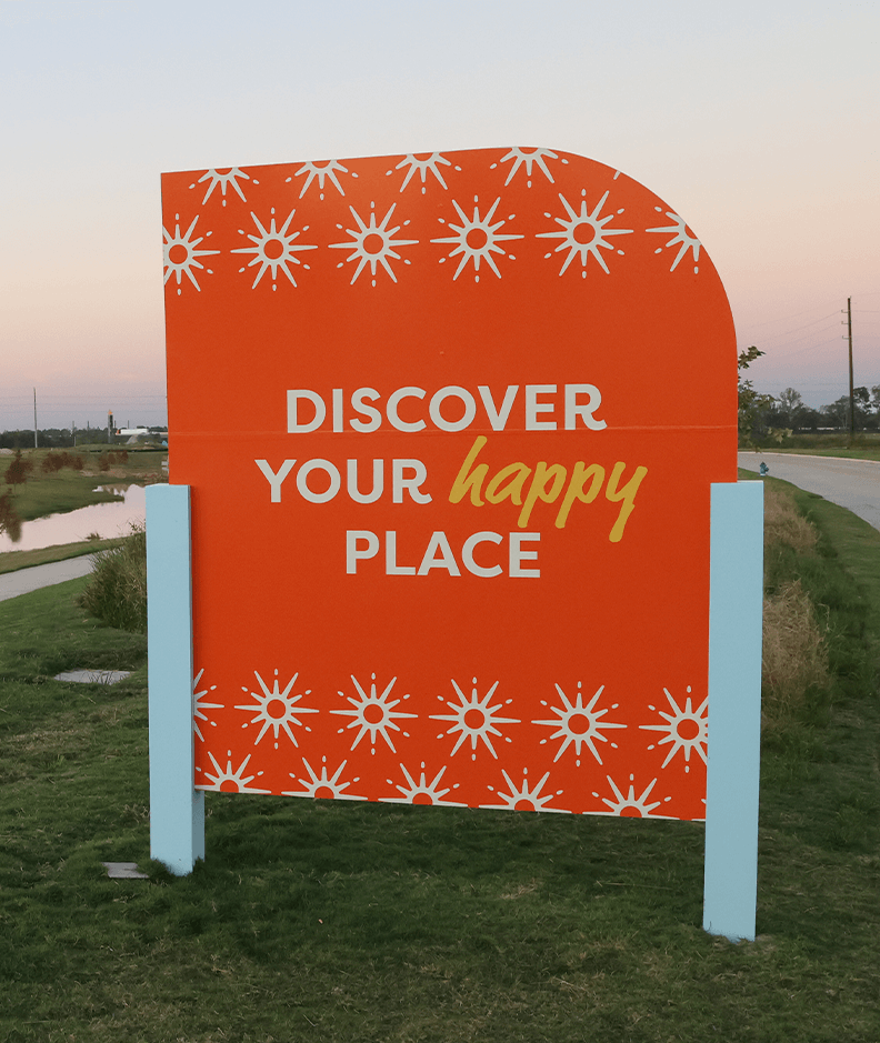 Signage design along the road in Jubilee with visuals related to the happy focus of the neighborhood, designed by ST8MNT