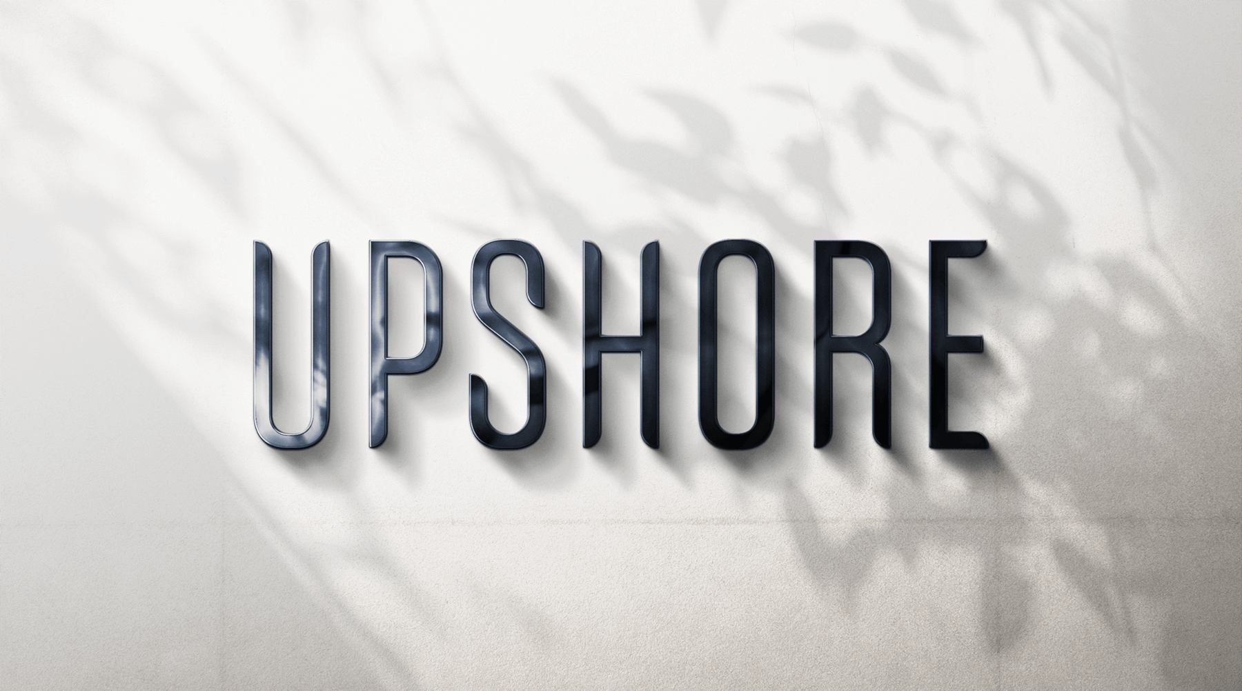 Upshore Signage Upshore wordmark mocked up as metal signage with leafy shadow overlays