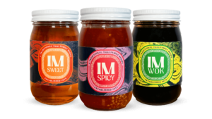 Colorful product packaging design for IM Sweet, IM Spicy and IM Wok sauces for International Market in Nashville, TN