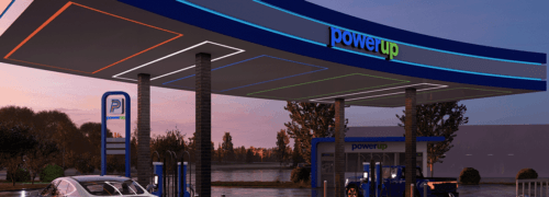 Rendering of PowerUp station at dusk with logo featured prominently