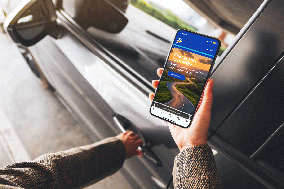 woman looking at powerup site on her phone